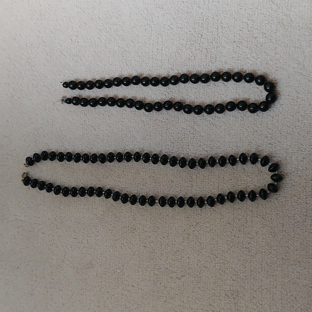 2 black statement necklaces